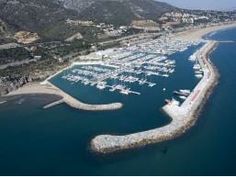 an aerial view of a marina with boats in the water