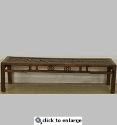 a wooden bench sitting on top of a tile floor next to a white wall with the words click to enlarge below it