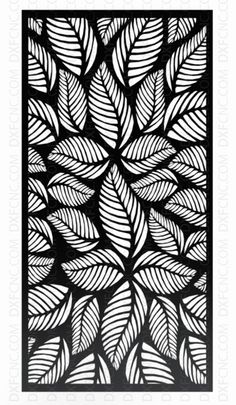 an intricate laser cutout with leaves in black and white