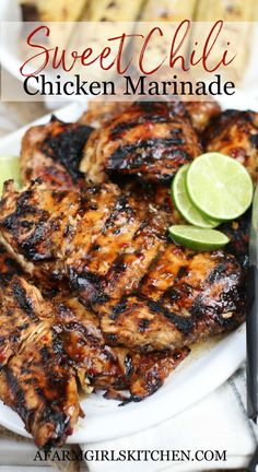 grilled chicken marinade on a white plate with lime wedges