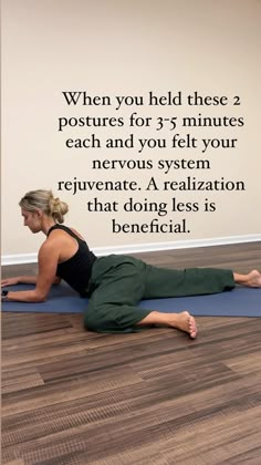 a woman is doing yoga on the floor with her back to the camera, and there is