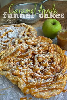 two cinnamon apple cakes sitting on top of a table