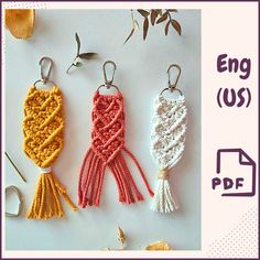 three crocheted keychains are shown with the words eng us on them