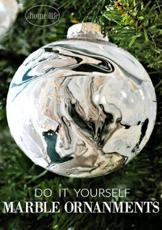 an ornament hanging from a christmas tree with the words do it yourself marble ornaments