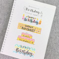 a spiral notebook with happy birthday stickers on it