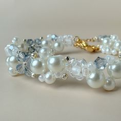 a bracelet with white pearls and crystal beads