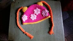 Adorable made to order Milli hat to dress up your little Umizoomi fan. Bright pink soft yarn with light pink flowers, yellow trim and orange braids are sure to please. The one shown here is 2T-4T. Would work great for a costume! Available to be custom made.  Please ask about combined shipping if needed and check out the Geo hat too! Comment in notes your desired size if different than options given.  Thank you for shopping! Crochet Football Hat, Team Umizoomi Birthday, Toddler Football, Team Umizoomi, Crochet Football, Light Pink Flowers, Fall Hats, Football Baby, Bear Hat