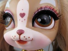 a close up of a doll's face and eyes