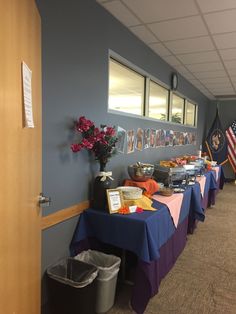 a long table with food on it in a room