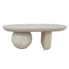 a white table sitting on top of a wooden base with an oval shaped object in the middle