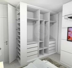 an empty white closet with drawers and shelves