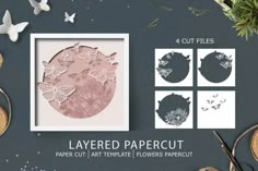 paper cut art templates with flowers, butterflies and other crafting supplies on the table