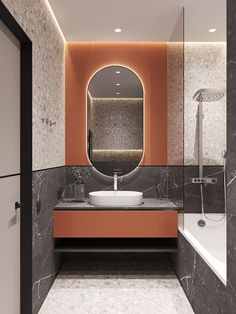 a bathroom with marble and orange accents