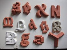 the letters and numbers are made out of clay