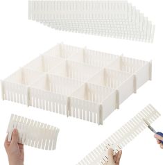 two hands are holding scissors and some white plastic boxes with dividers on each side