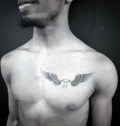 a man with an angel tattoo on his chest