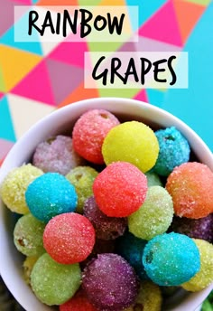 rainbow grapes in a white bowl with the words rainbow grapes above it and colorful background