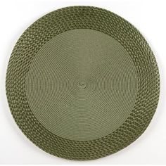 a green place mat with an oval design on the center and bottom, in front of a white background