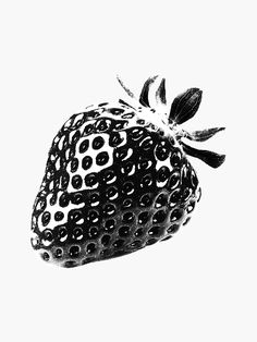 a black and white photo of a strawberry