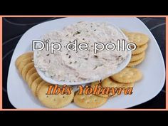 dip de pollo with crackers on the side and an orange border around it