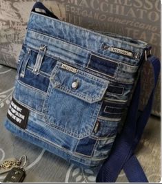 a denim purse sitting on top of a couch