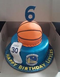 a birthday cake with a basketball on top