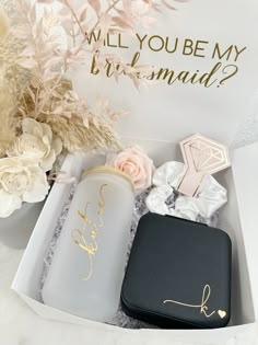 a personalized gift box for bridesmaids with flowers and jewelry in it that says, will you be my bridesmaid?