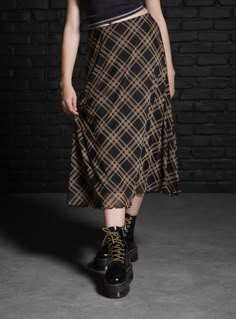 Mix up your plaid skirt rotation with this midi style. It has a mesh overlay printed with black and brown plaid. It's fully lined with an elastic waistband.95% polyester; 5% spandexWash cold; dry lowLength: 29''ImportedListed in junior sizes Houska Castle, Skirts Hot, Social Collision, Plaid Midi Skirt, Tall Hoodies, Plus Size Fits, Alt Fashion, Mesh Overlay, Brown Plaid