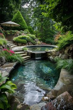 an outdoor pool with steps leading up to it and a waterfall running down the side