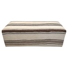 a striped bench cushion on a white background