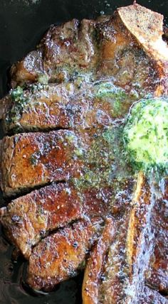 some meat is cooking in a pan with broccoli sauce on the top and side