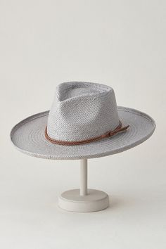 When the dress code reads "summer style but make it western," slip on the Nuvola, a beautifully crafted Toyo straw hat with a decidedly Old West flavor. Featuring a wide brim that's slightly rolled up at the edges and a tall teardrop crown, this timelessly fashionable straw hat is lightweight and ready for sunny days. It has a sweatband for comfort that's adjusted by hidden Velcro, and a braided faux leather hatband for a handsome finish. Business Travel Bag, Capes & Ponchos, Boots Square Toe, Sheepskin Slippers, Sheepskin Coat, Western Hats, Mens Gloves, Hat Band, Brim Hat