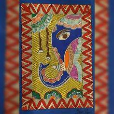 an art work depicting the face of lord ganesha in blue and red colors