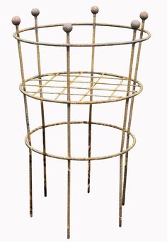 a metal rack with three balls on it's sides and two poles attached to the top