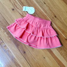 Gymboree Baby Girls Skirt Size 6-12 Months Coral Colored Skirt With Attached Shorts (Skort). Adorable Two Layer Ruffle Skirt With Shorts Attached. White Scalloped Edging. Never Worn, Zero Flaws, Tags Still Attached. Smoke Free, Pet Free Home Reborn Clothes, Layered Ruffle Skirt, Weaving For Kids, Skirt With Shorts, Girls Skirt, Ruffle Skirt, Coral Color, Kids Bottoms