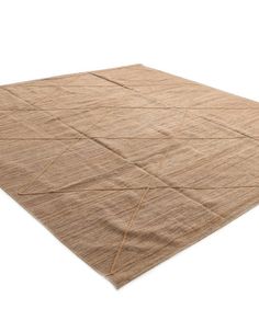 a beige area rug on a white background with no one in it or someone else