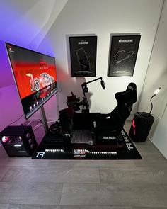 a gaming room with two monitors, a keyboard and mouse