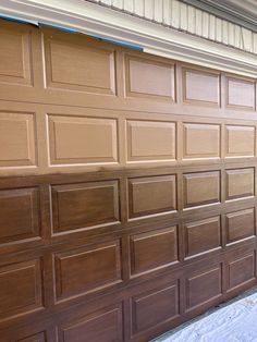 a brown garage door that has been painted