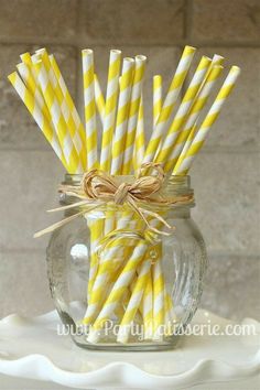 yellow and white striped paper straws in a mason jar