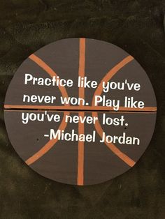 a basketball with the quote practice like you've never won play like you've never lost michael jordan