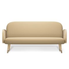 a beige couch sitting on top of a white floor