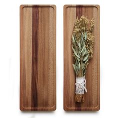 two wooden cutting boards with dried herbs on them