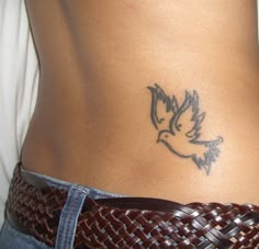 a woman with a bird tattoo on her stomach