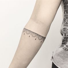 a woman with a tattoo on her arm