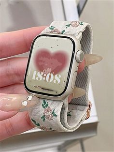 a woman holding an apple watch with the words i love us on it