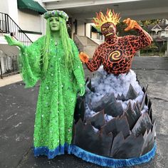 two people dressed in costumes standing next to each other