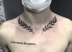 a man with a face mask on his head has a tattoo that reads, so faz sentio