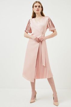 Give In To The Touchable Texture Of This Softly Hued Wrap Dress For Spring. It Blends Sharply Pressed Pleats With Romantic Puffed Sleeves, Sumptuous Blush-Pink Satin And A Waist-Defining Belt To Flatter Your Frame. Slip It On To Add An Effortlessly Put-Together Feel To Any Occasion. Elegant Pink Belted Midi Dress, Pink Pleated Formal Dress, Pink Pleated Skirt Dress For Formal Occasions, Formal Pink Pleated Dress, Pink V-neck Pleated Dress For Party, Elegant Spring Pleated Dress With Folds, Elegant Spring Belted Pleated Dress, Pink V-neck Dress With Pleated Waist, Pink V-neck Dresses With Pleated Waist