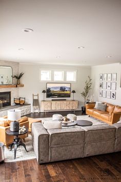 a living room filled with furniture and a fire place