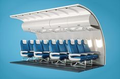 an airplane's seats are lined up in the shape of a curved wing, against a blue background